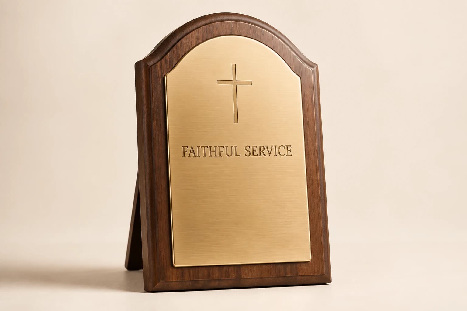 Arched walnut pastor plaque with brass and a simple engraved cross.